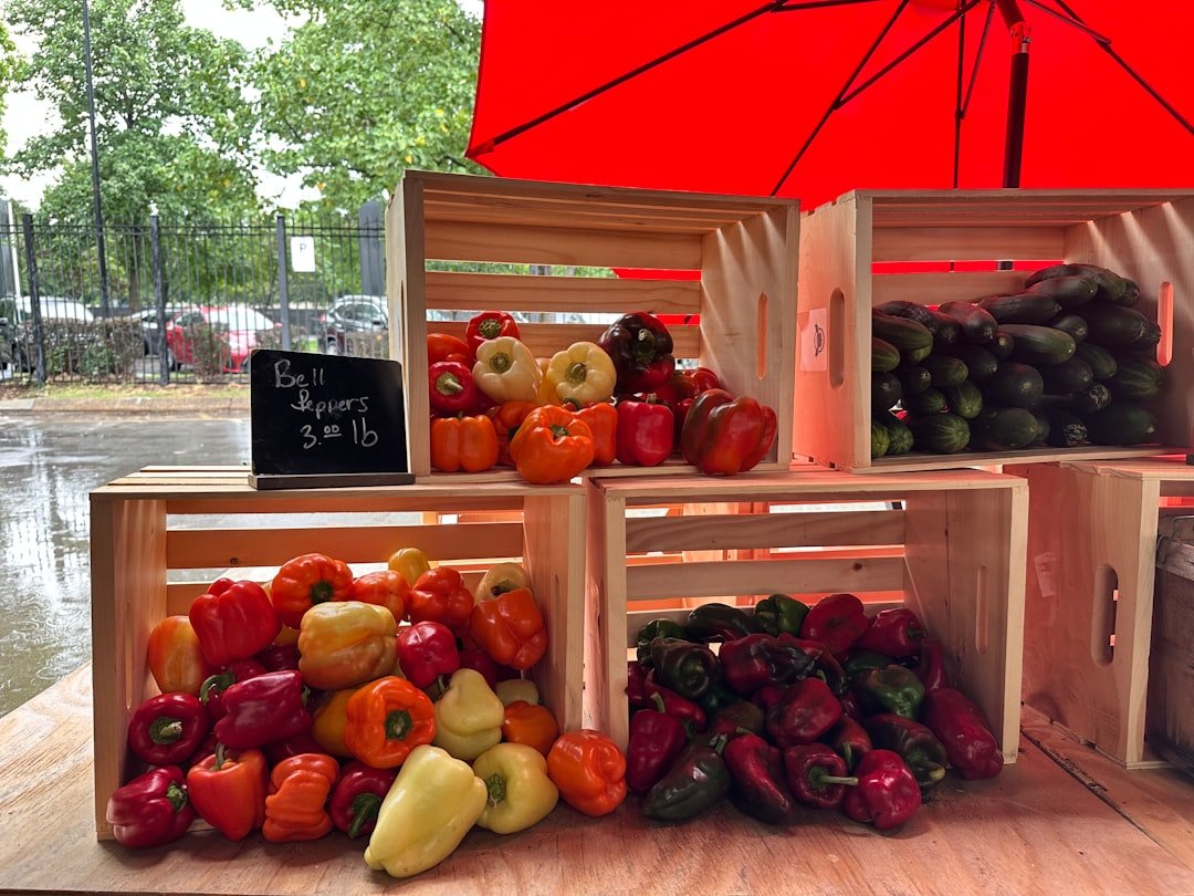 a-pile-of-fruit-sitting-on-top-of-a-wooden-table-vegchpznx6k